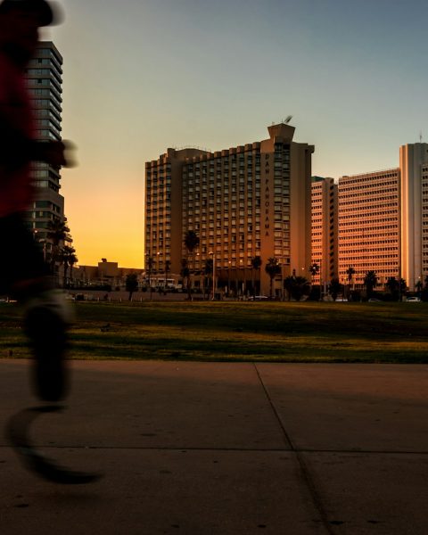 man running on pavement during daytime