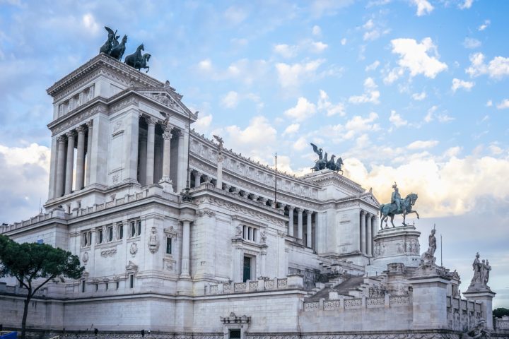 a large building with statues on top of it