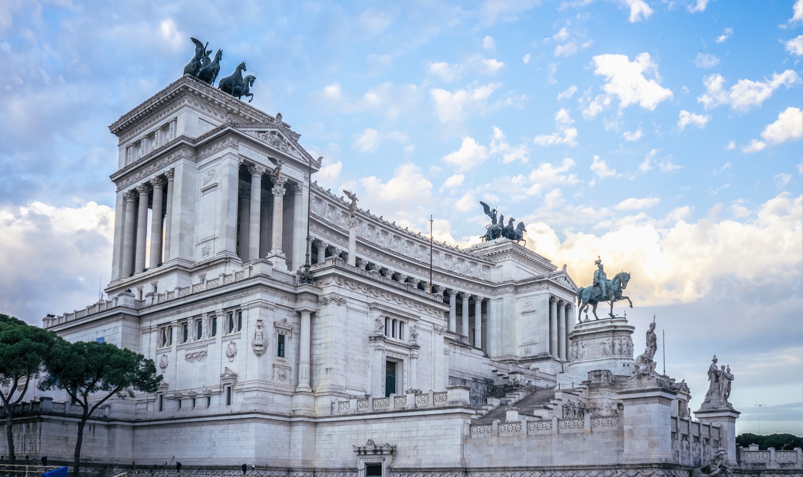 a large building with statues on top of it