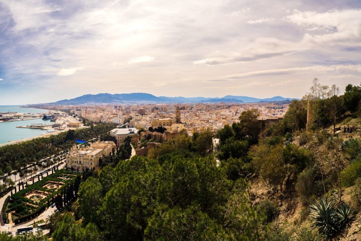 a scenic view of a city and a body of water