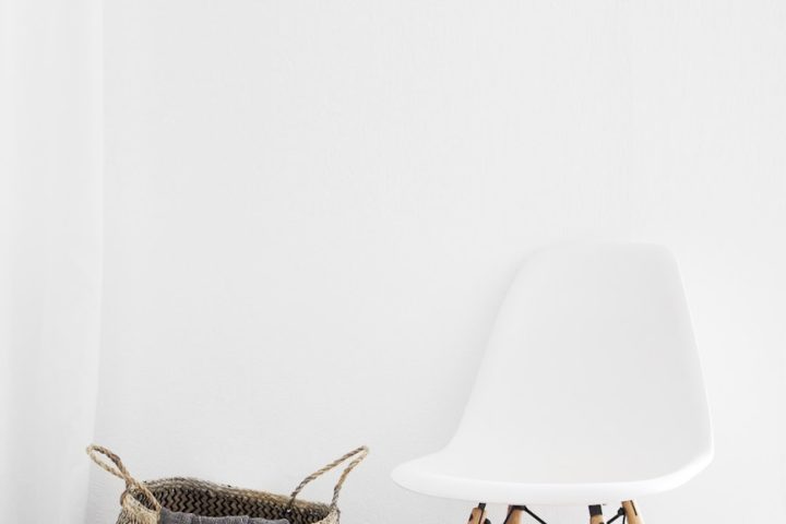 white and brown chairs beside wicker basket near white wall