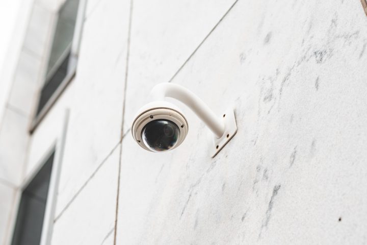 white round light bulb on white concrete wall