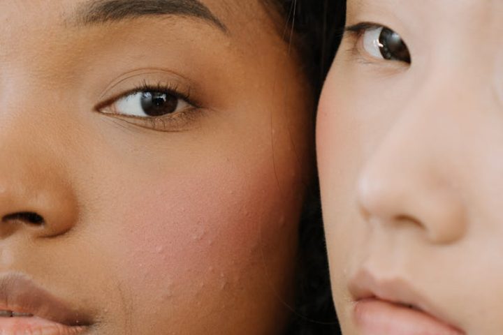 Close-up portrait of two women showcasing diverse beauty and natural skin.