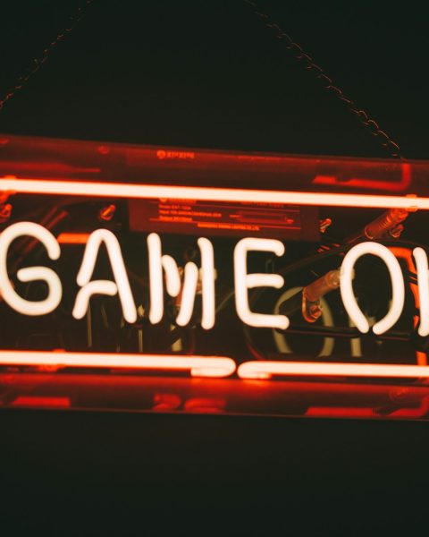 red and white Game On LED signage